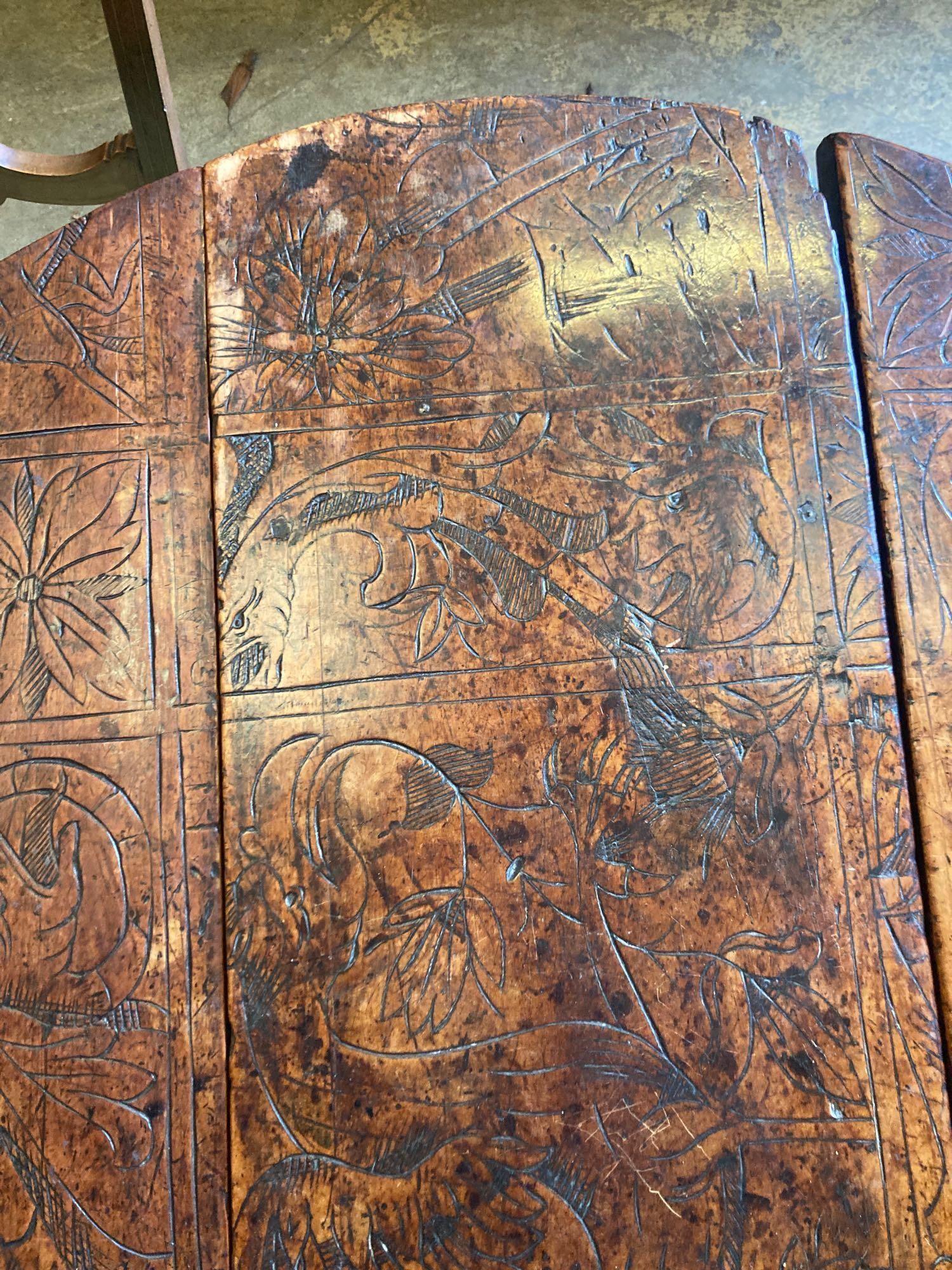 An 18th century carved and stained walnut gateleg table, with oak underframe, width 106cm, 116cm with flaps out, height 74cm